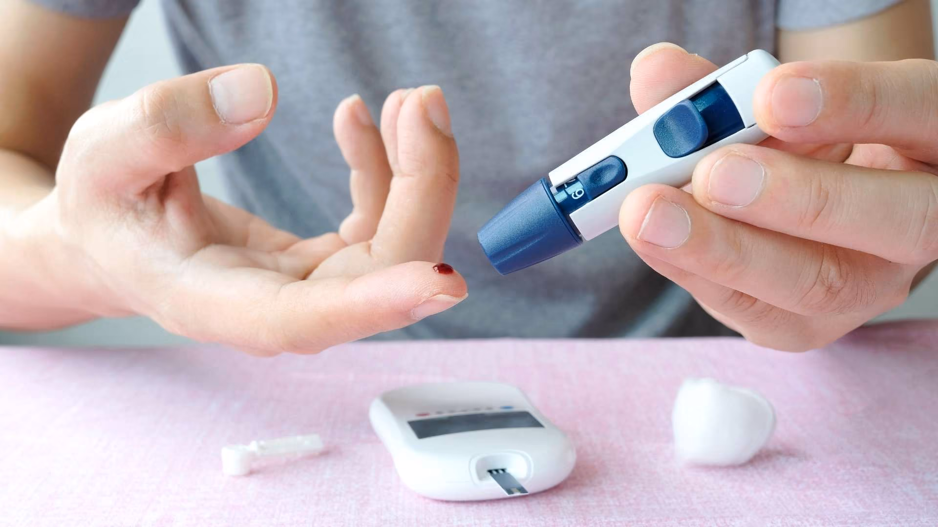 A person monitors their blood sugar levels