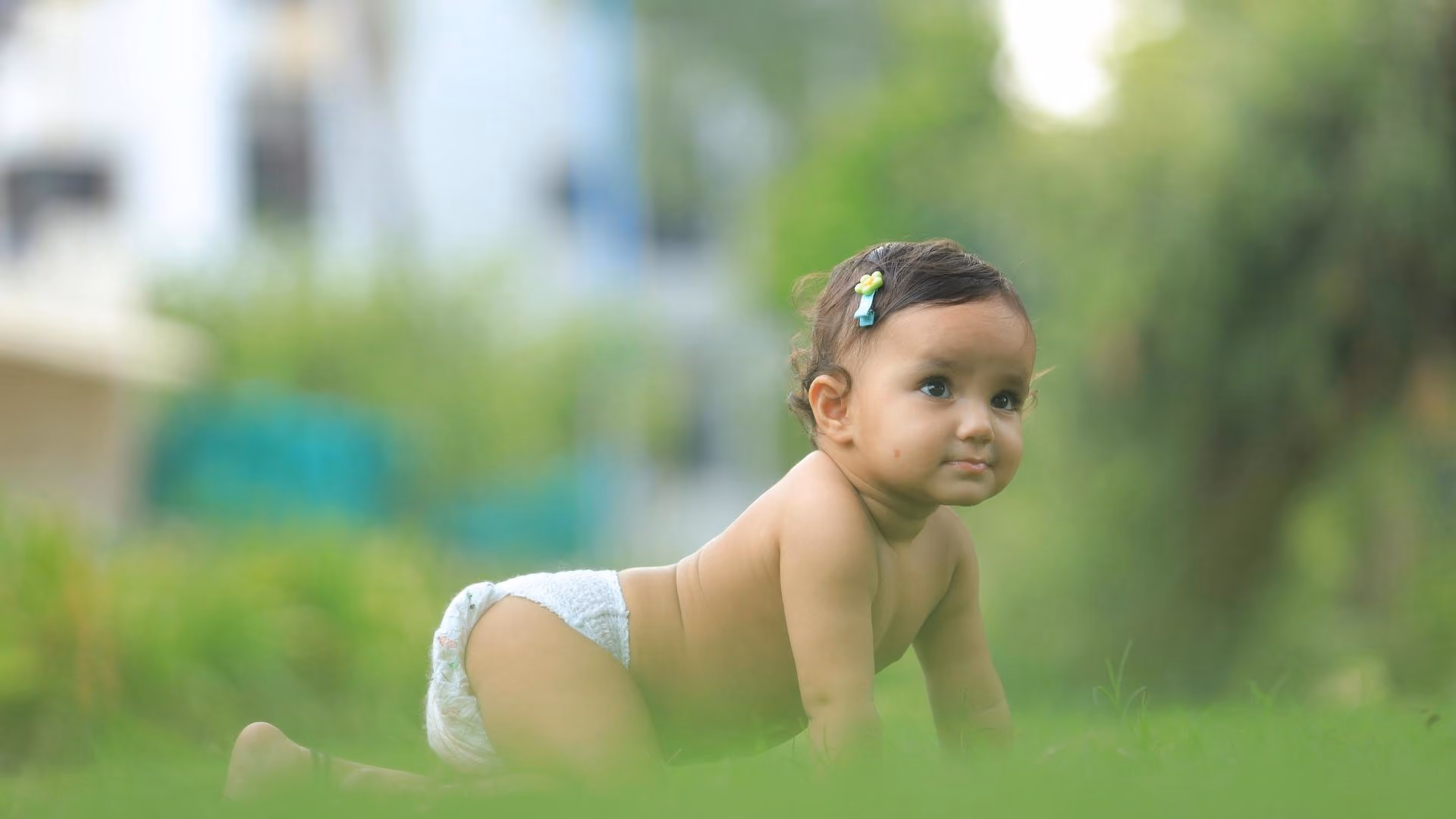 A baby crawls on the ground