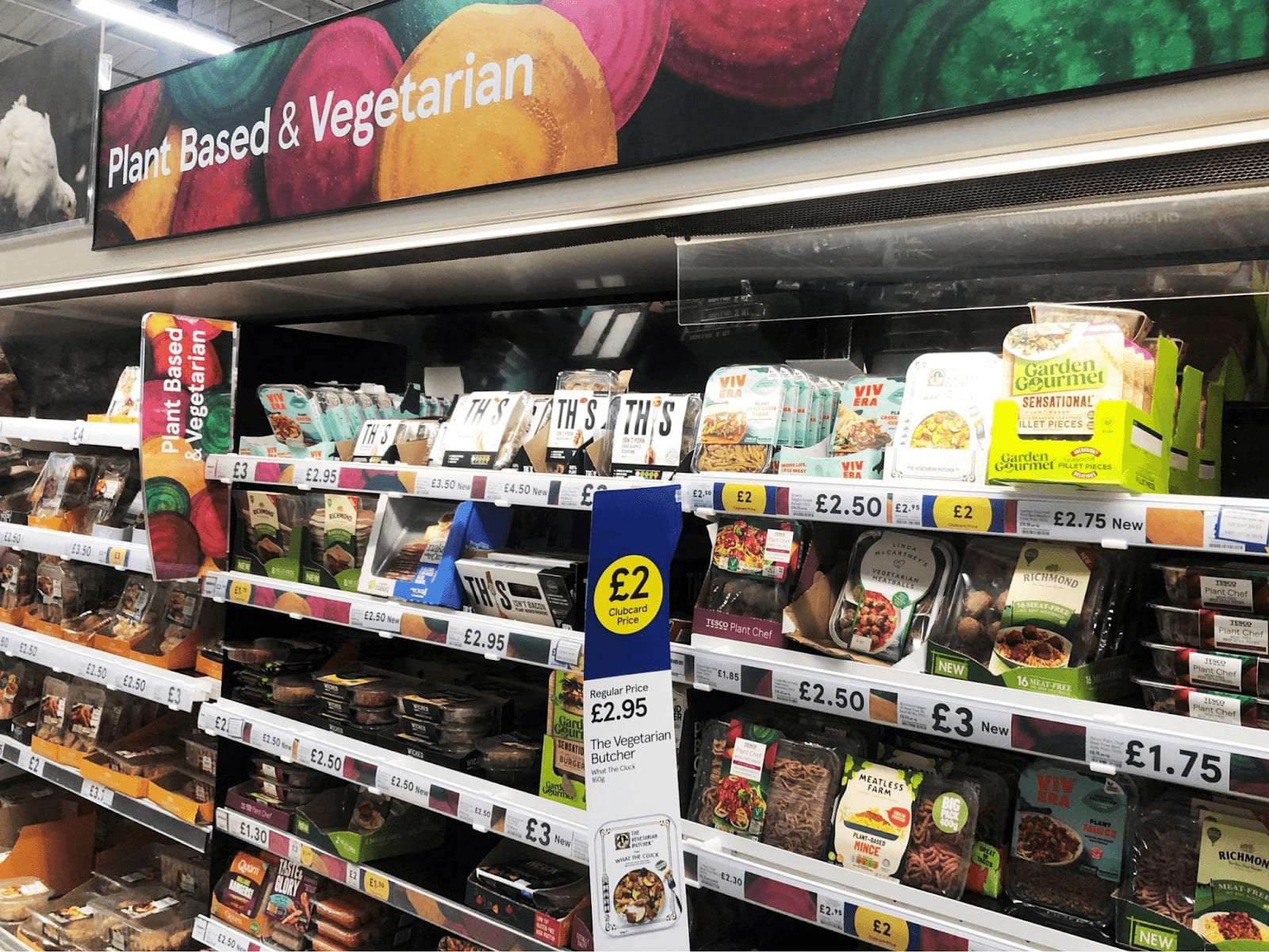 A supermarket aisle with various plant-based meat products