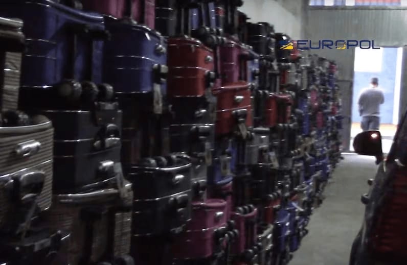 A screenshot from a video released by Europol in April 2018 showing suitcases police say were going to be used to smuggle elvers from Spain to Asia.