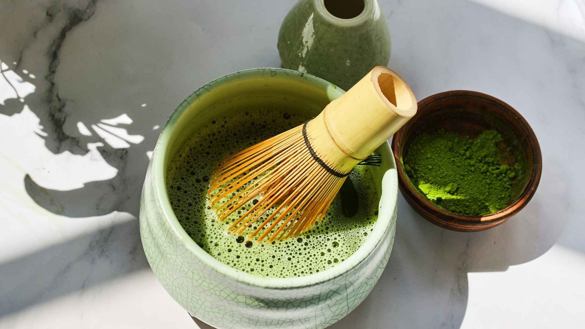 Someone prepares some fresh matcha