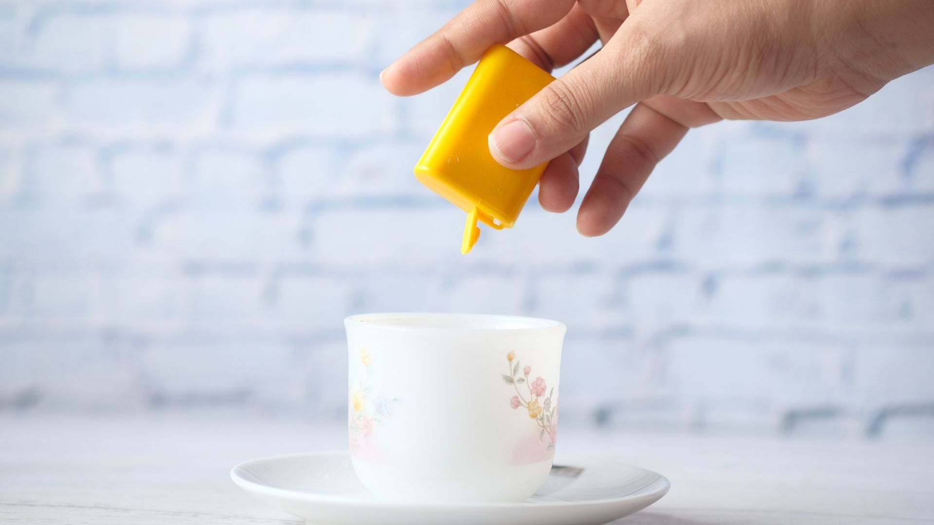 Artificial sweetener being used in a coffee