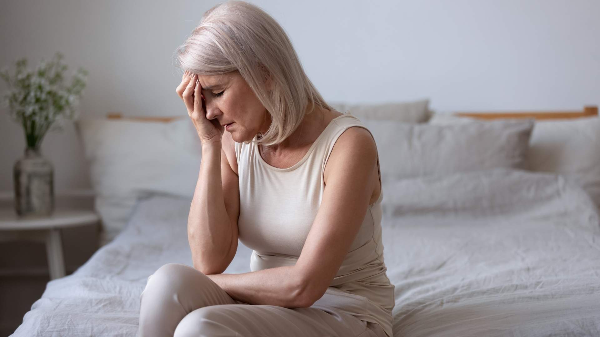 A women experience the menopause struggles with pain