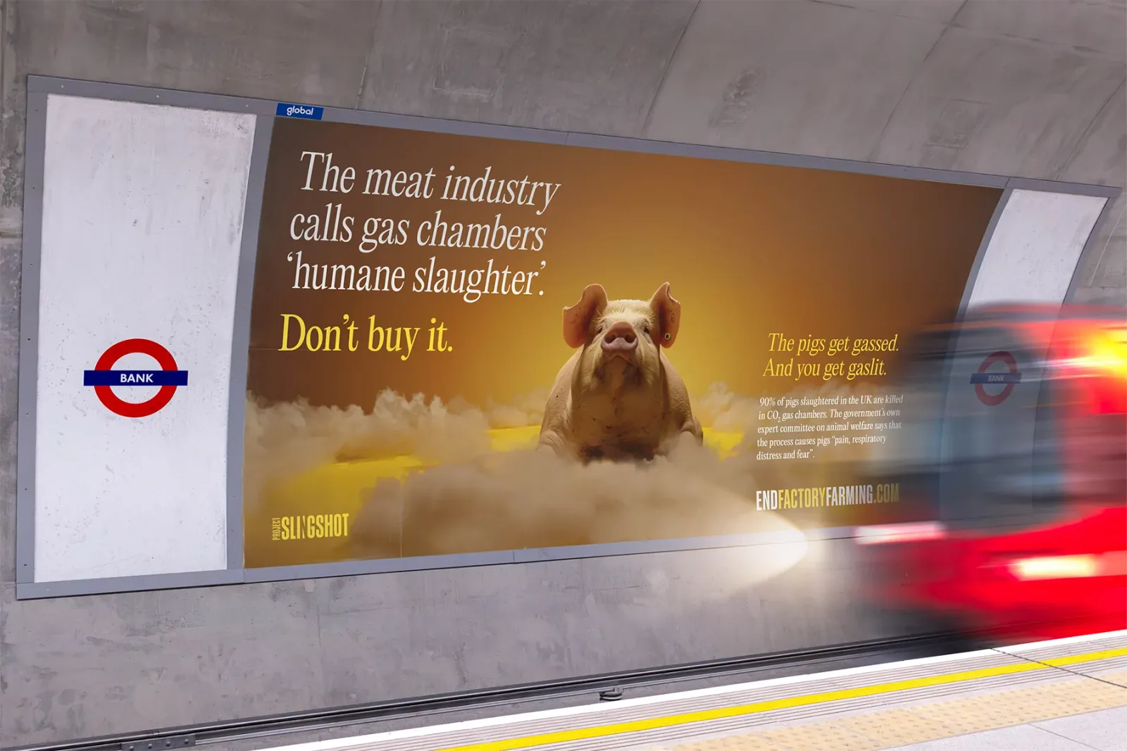 Project Slingshot advert on a London Underground platform showing a pig in a cloud of gas under the line 'Don't buy it'.