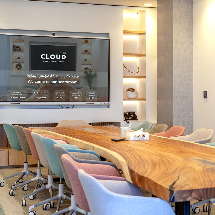 Modern meeting room at Cloud Spaces Roshn Front Riyadh with wooden table and screen