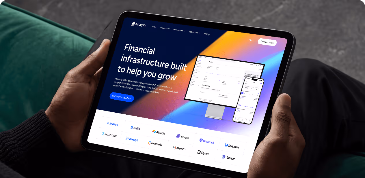 Person holding tablet showing Accepty's financial platform with app interface and partner logos by wavespace.