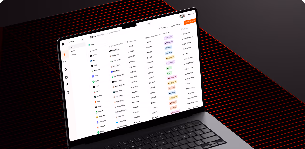 Laptop screen displaying a deals and contacts management dashboard with company names and project statuses by wavespace.