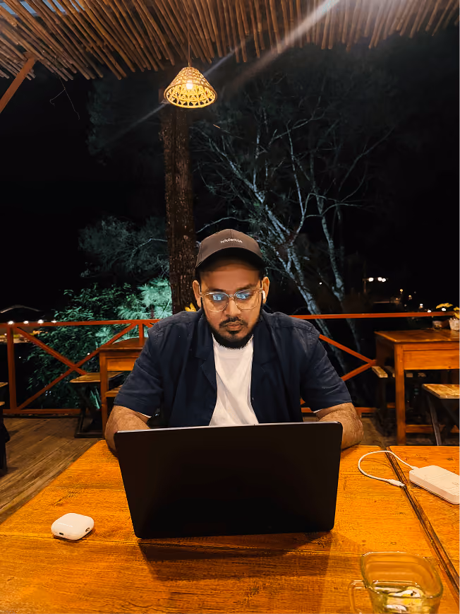 Working on a laptop from an outdoor cafe