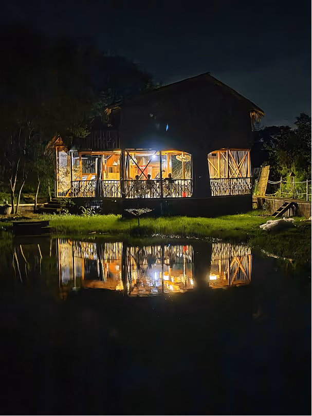 Night view of a lakeside cabin