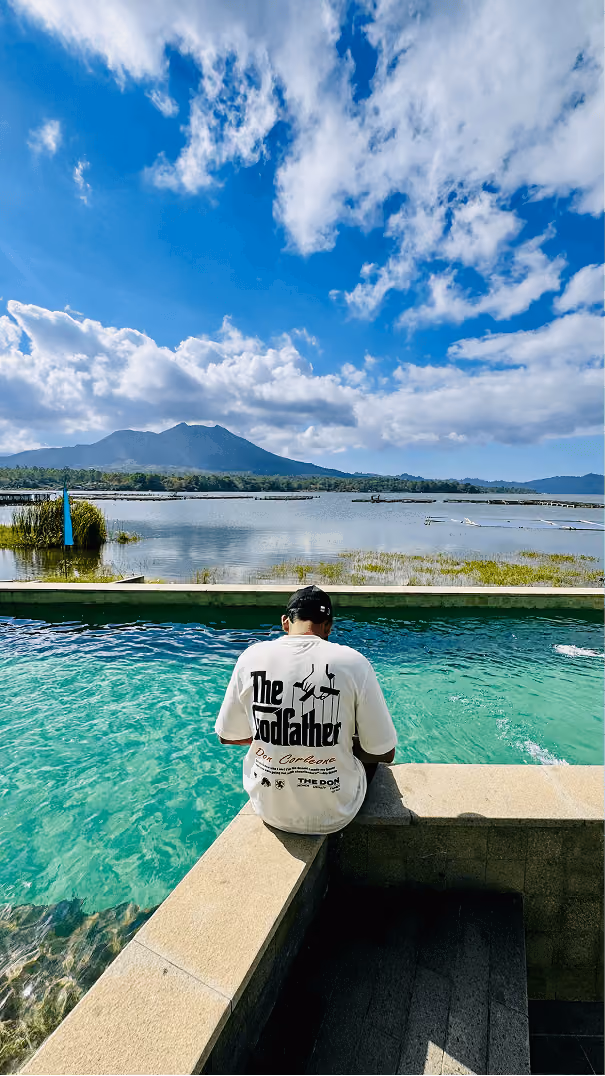 Sitting by the pool with a scenic lake view