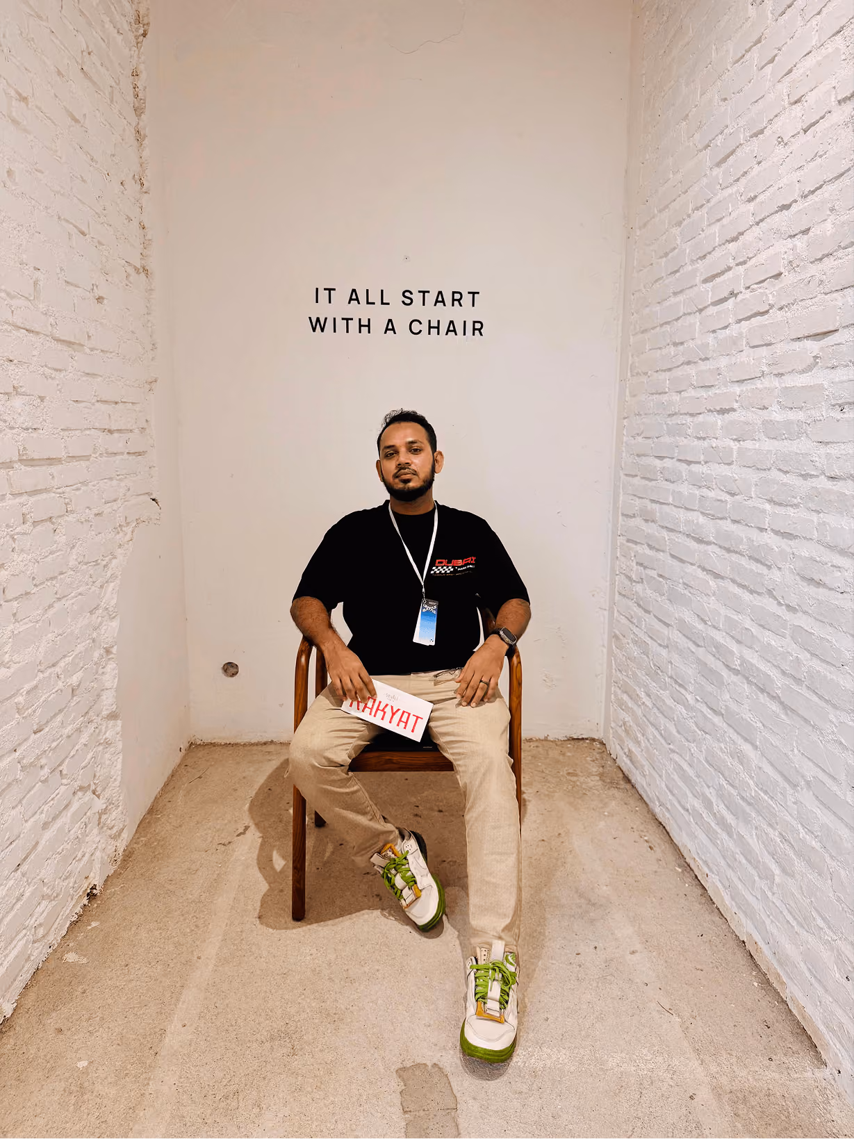 Shahid miah ceo of Wavespace sitting in a minimal art space
