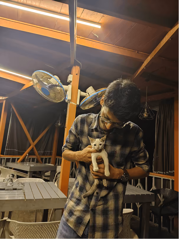 Holding a kitten during a team retreat