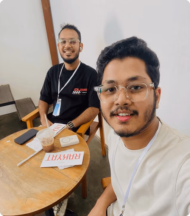 Two Wavespace team members taking a selfie at a cafe table