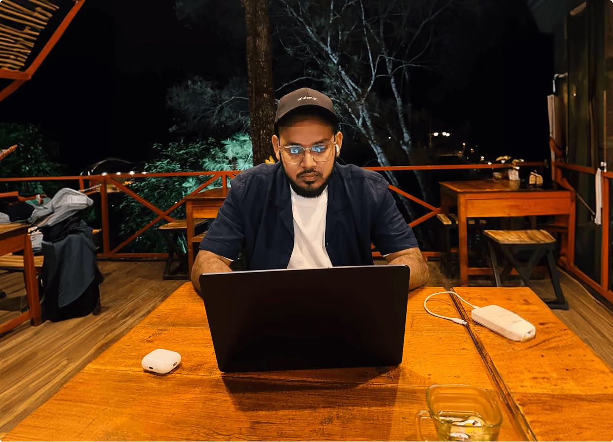 A Wavespace designer working on a laptop at night