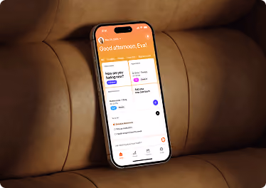 Mobile app UI/UX design by Wavespace on a phone resting on a leather sofa