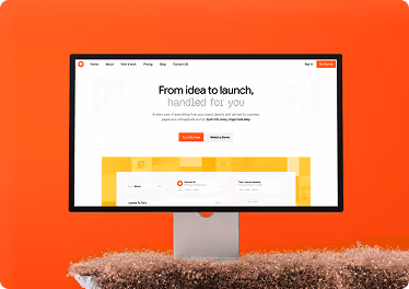 Website design by Wavespace shown on a desktop monitor against an orange background