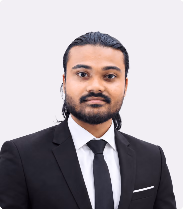 Barakatullah, Head of Design at Wavespace, in a black suit and tie