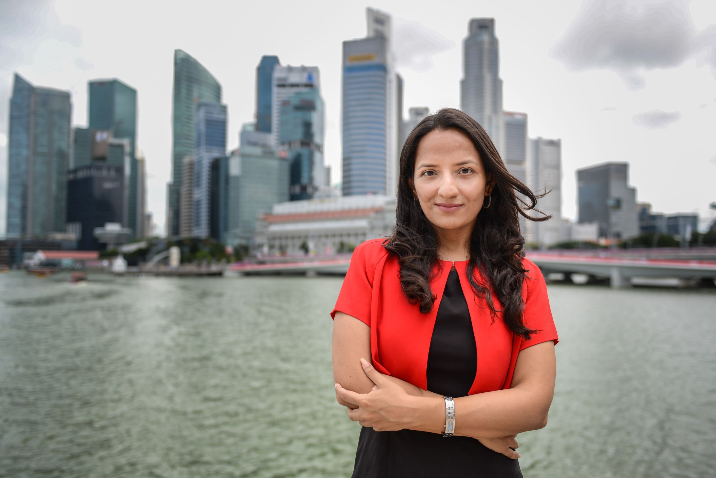 Priyanka Nath, fractional CMO in Singapore, with the Singapore CBD skyline behind her