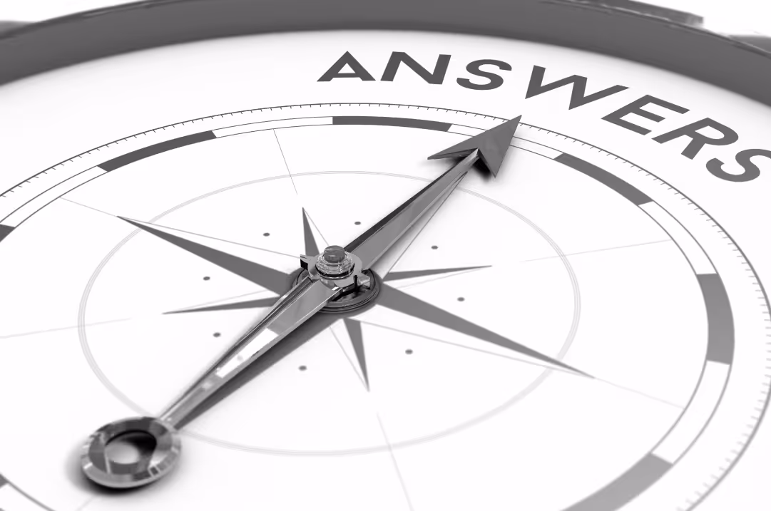 A needle on a compass points to the word ANSWERS.