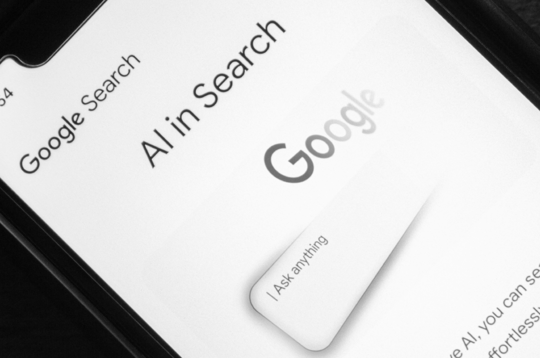 A mobile screen displays Google Search's "AI in Search" page.