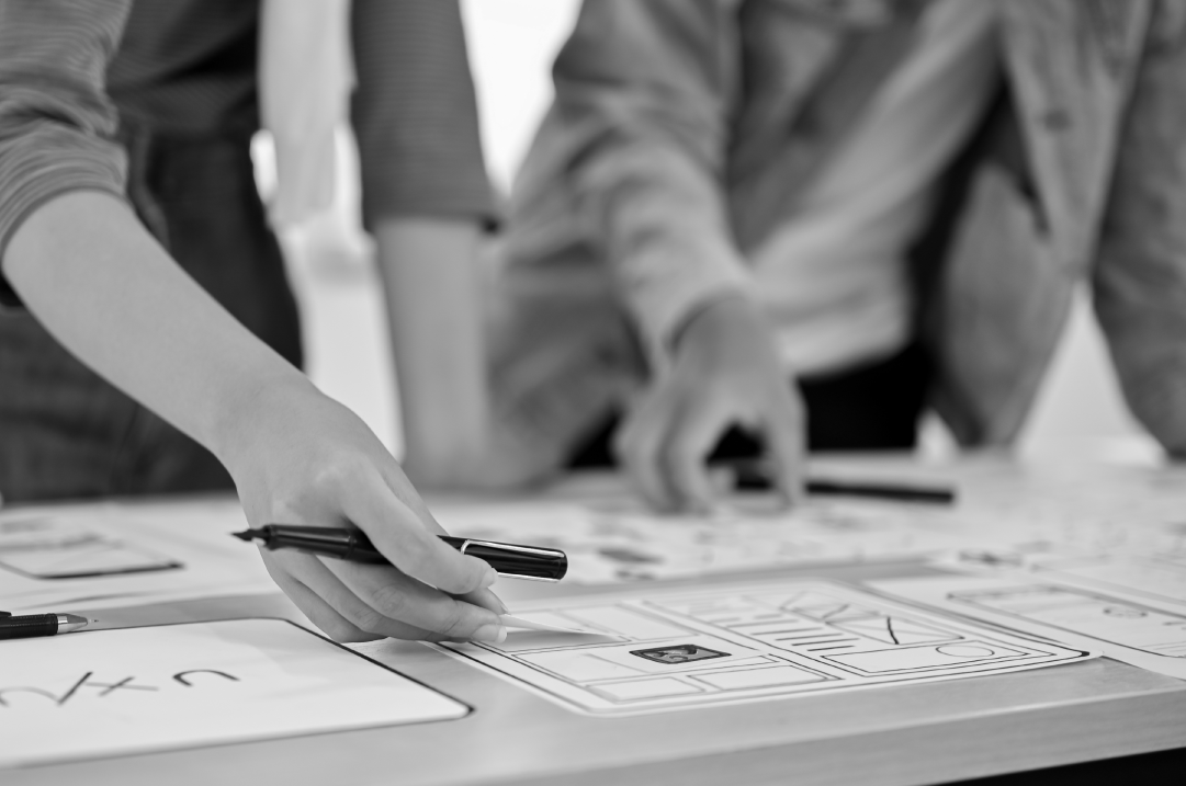 Team working on a UX design layout.