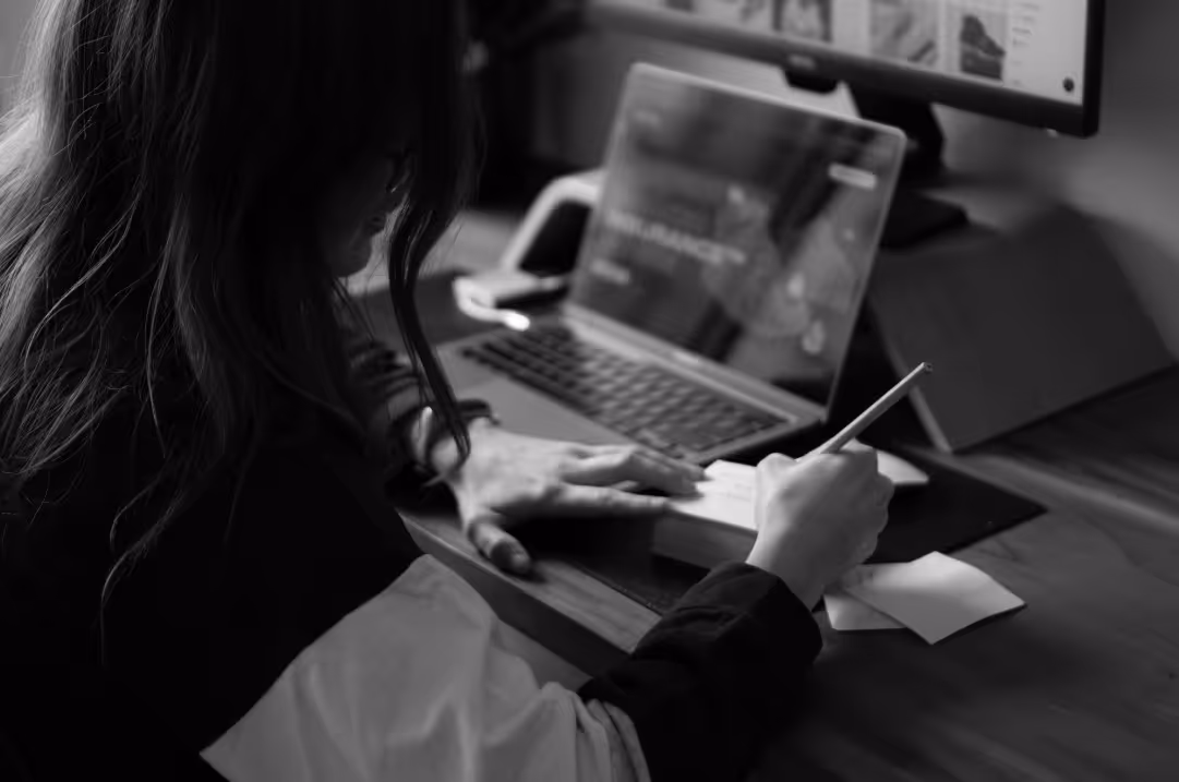 A professional taking notes while crafting B2B storytelling content.