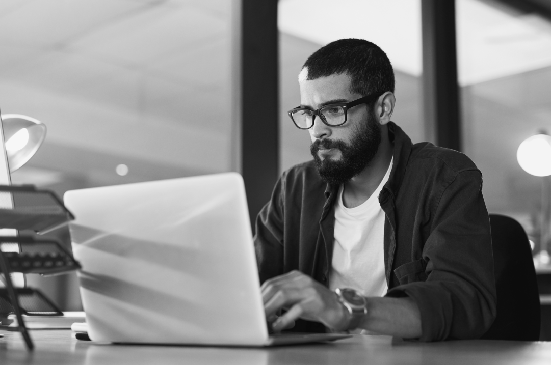 A developer is working on a laptop while implementing a headless CMS.