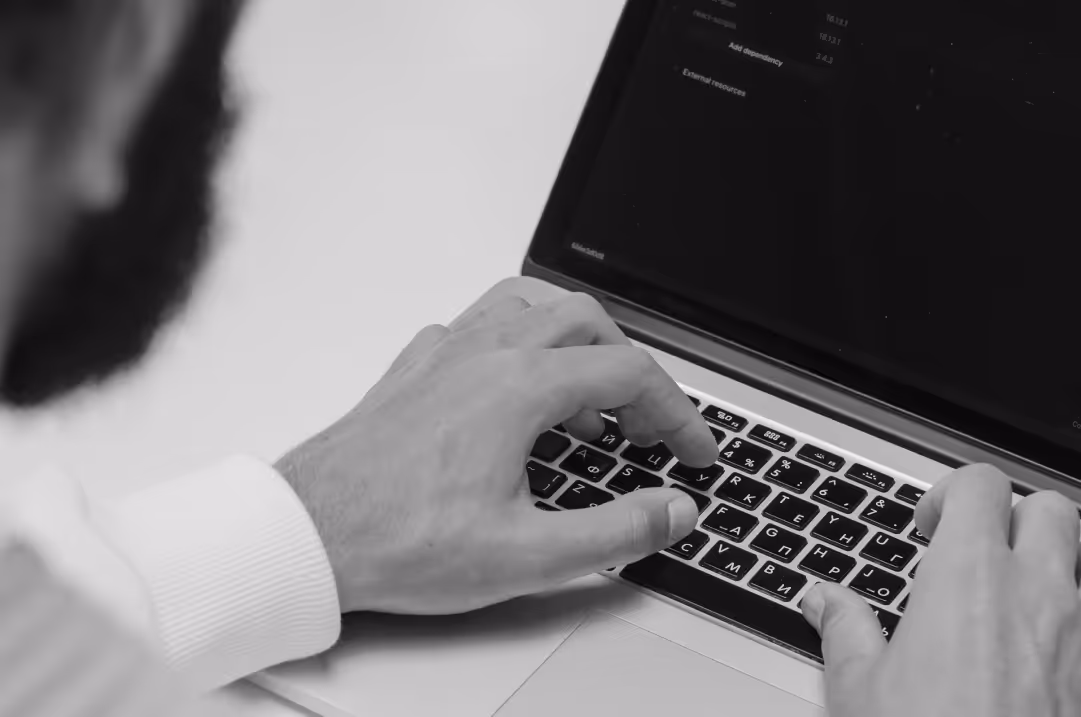 A person is typing on a laptop.