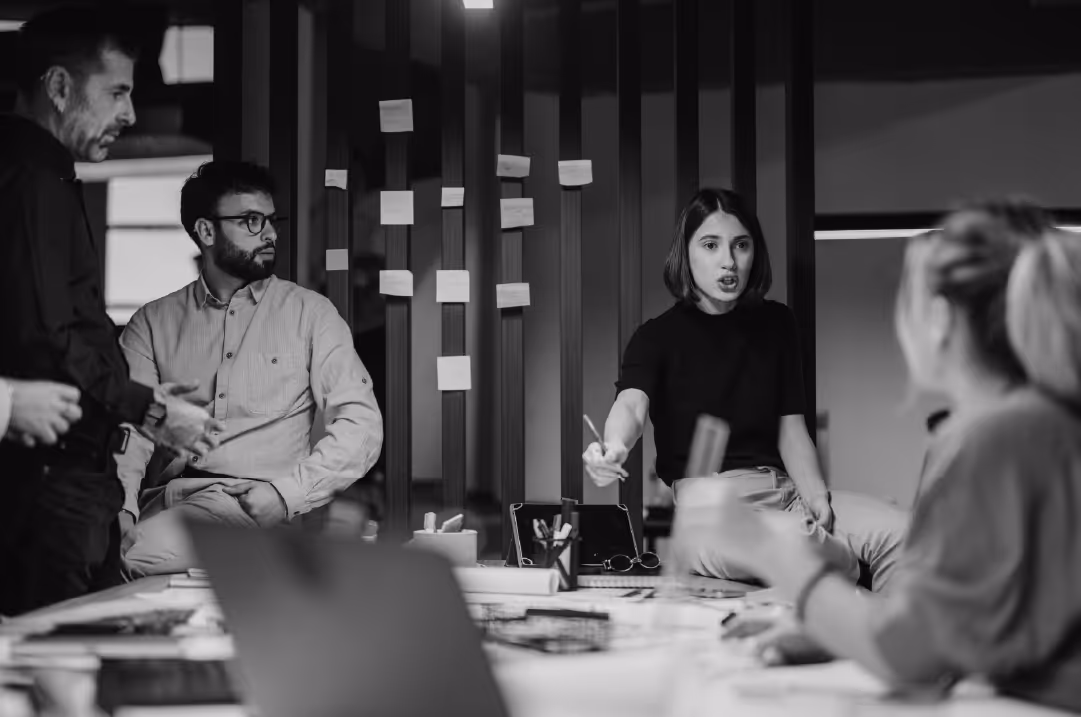 B2B team discussing how to improve website engagement in a strategic meeting.