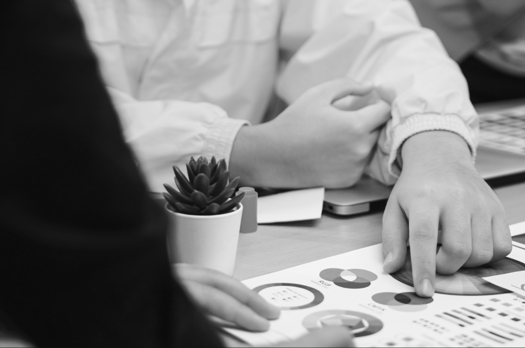 Team reviewing SaaS branding data charts during a strategy meeting.
