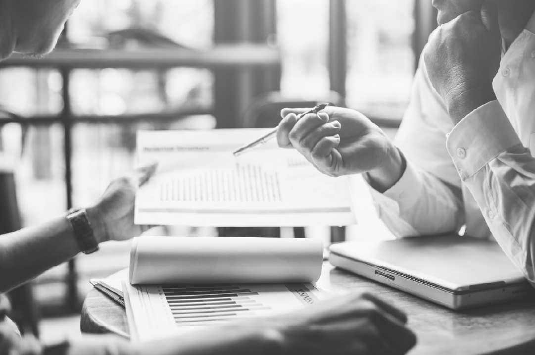 B2B team reviewing digital brand strategy and performance metrics during planning session.