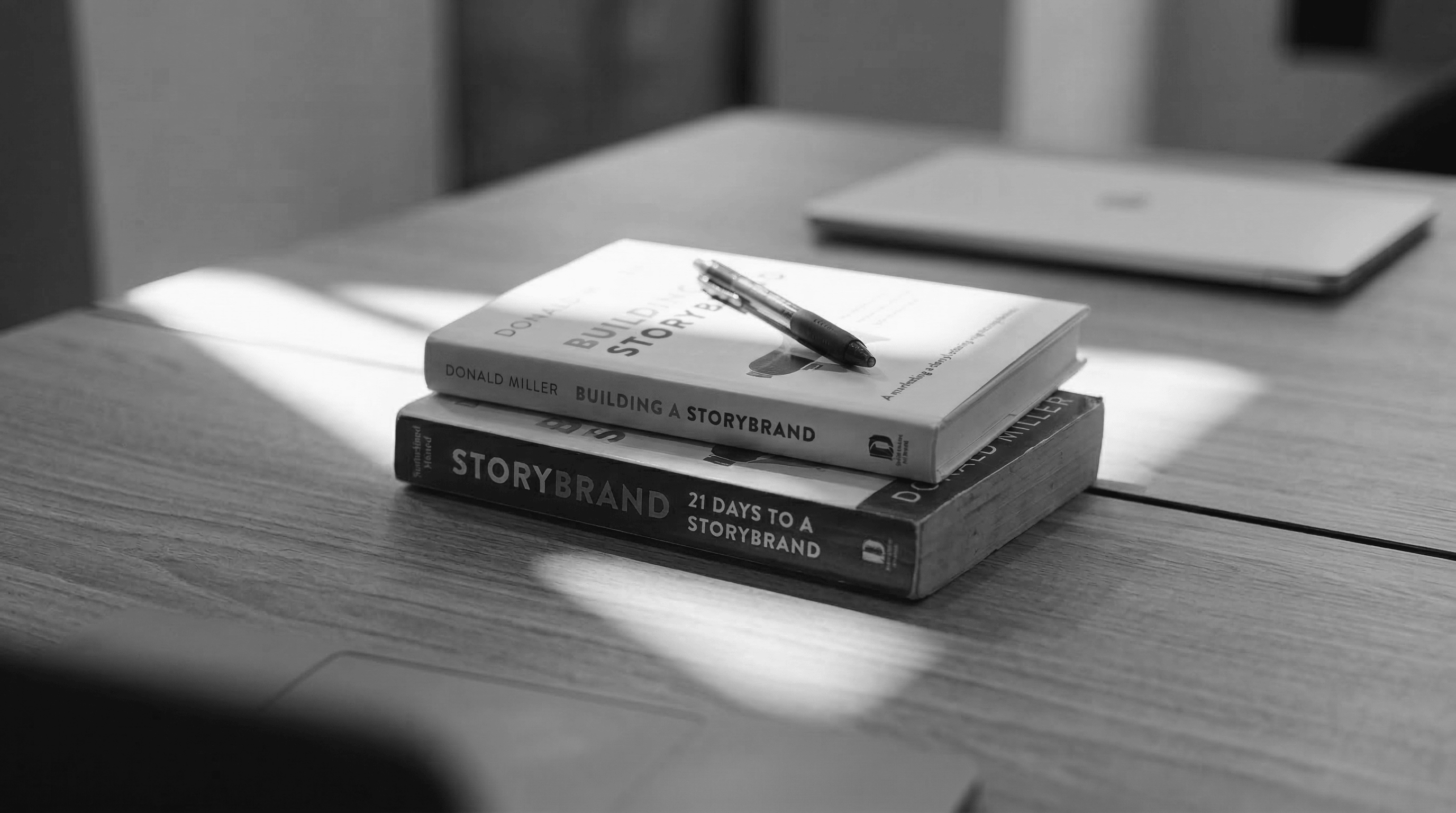 StoryBrand marketing books on a table.