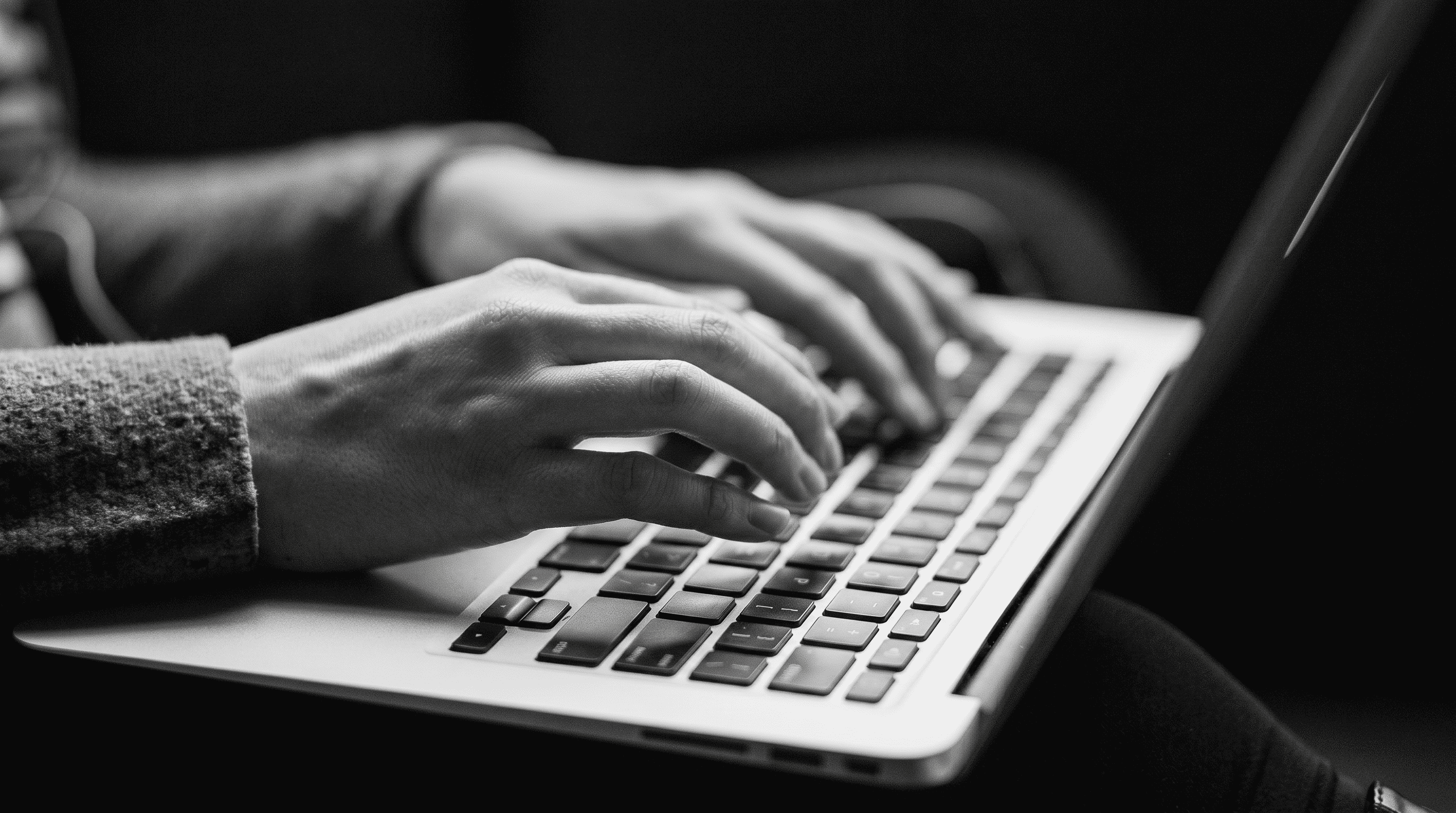 B2B web designer typing on laptop evaluating agency work and website strategy