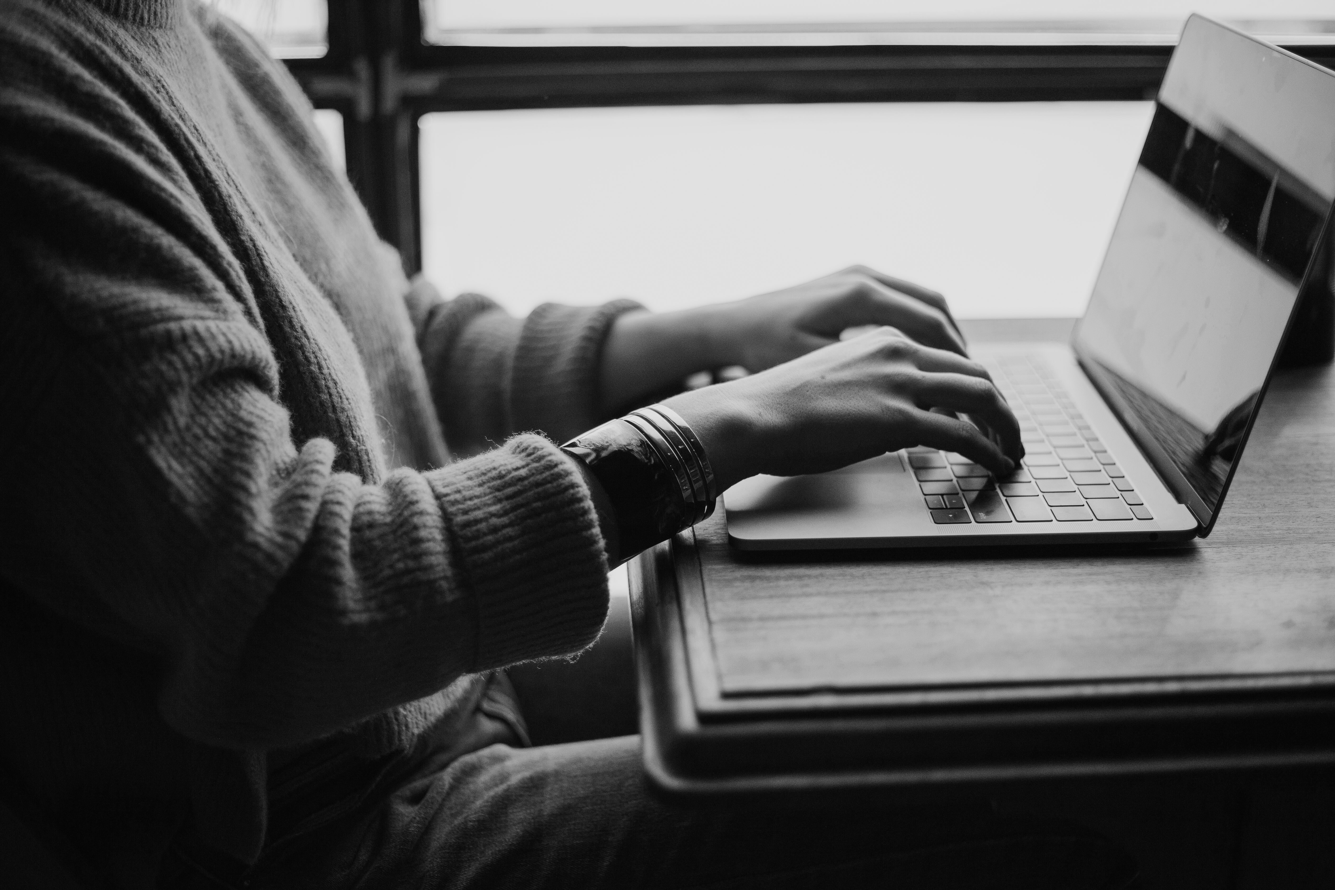 B2B professional weighing custom software development build vs buy on a laptop