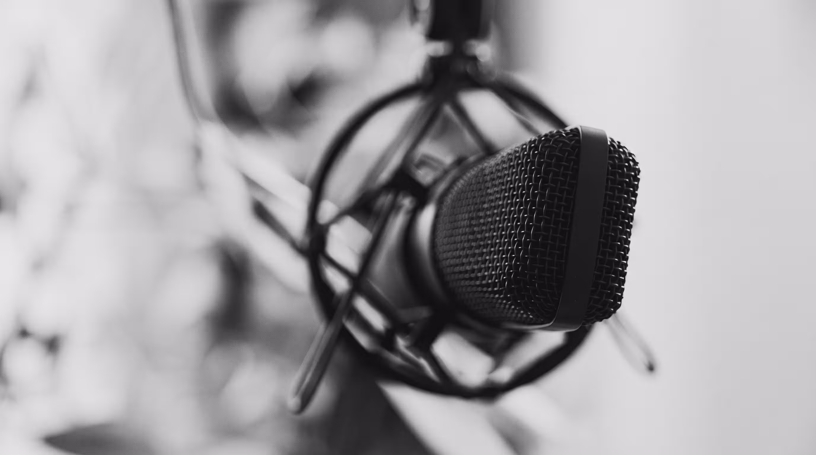Black and white close-up of a studio microphone