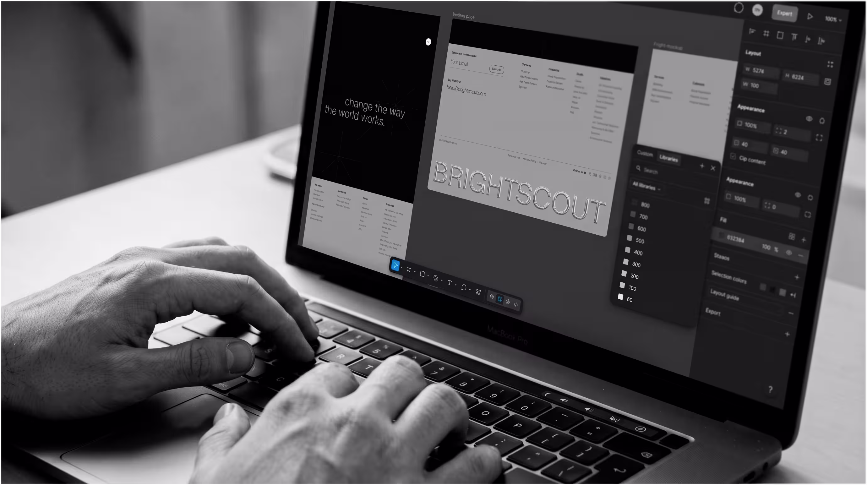 Black and white photo of someone editing a website design and color tokens in a design tool