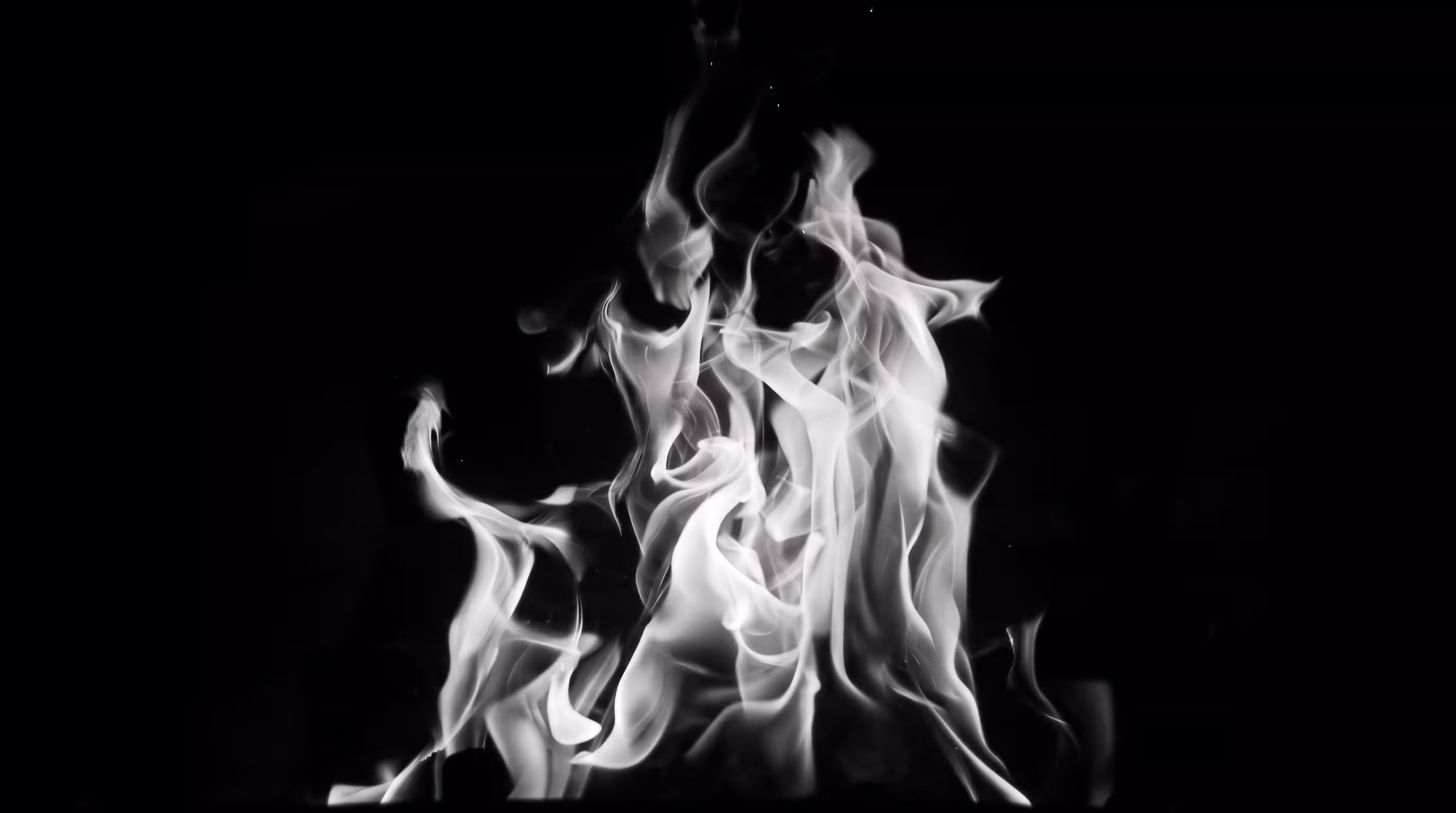 Close-up of fire flames in black and white
