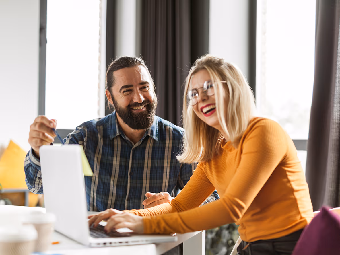 Two colleagues at work having a good time