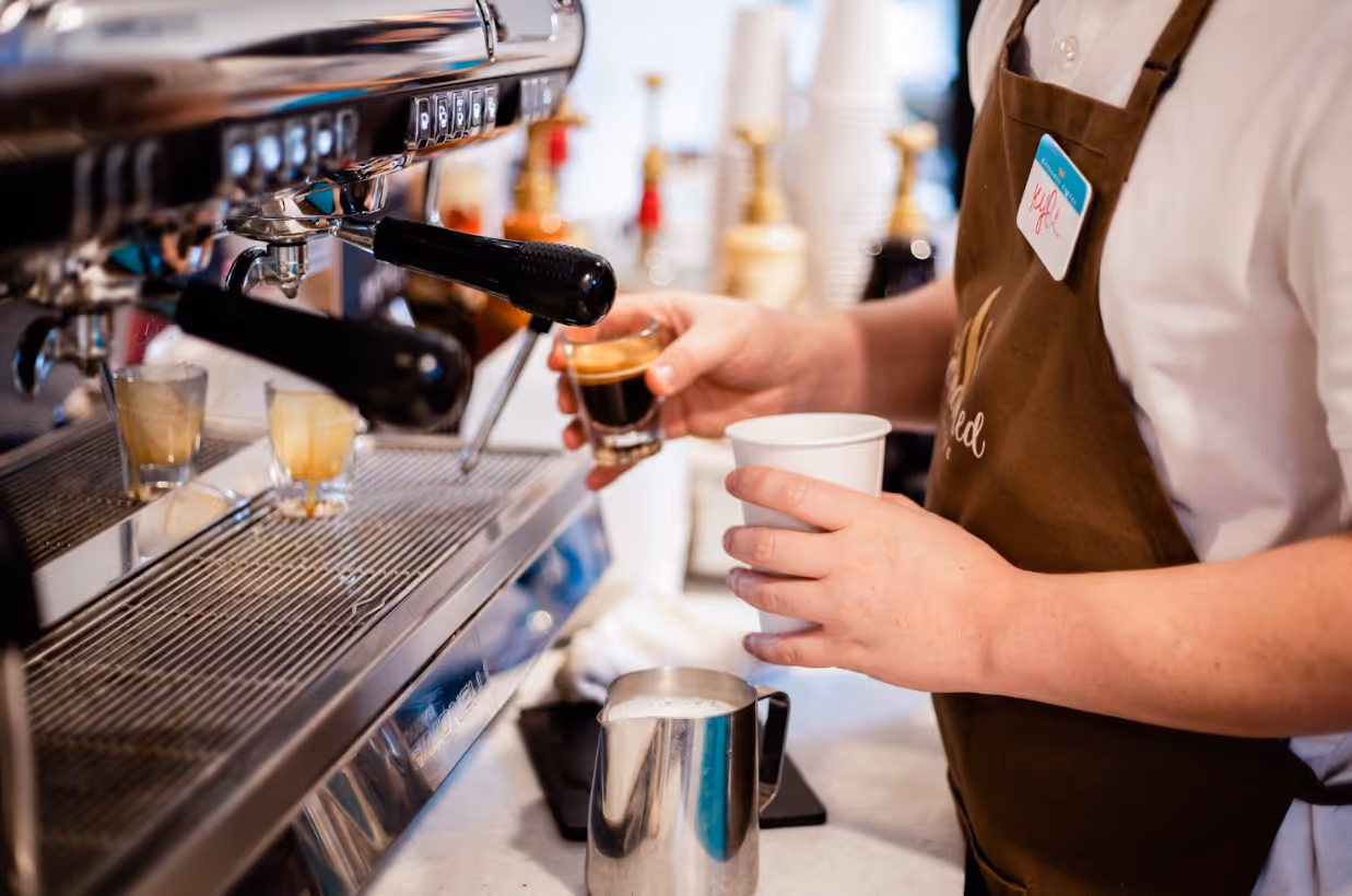 Barista pouring espresso