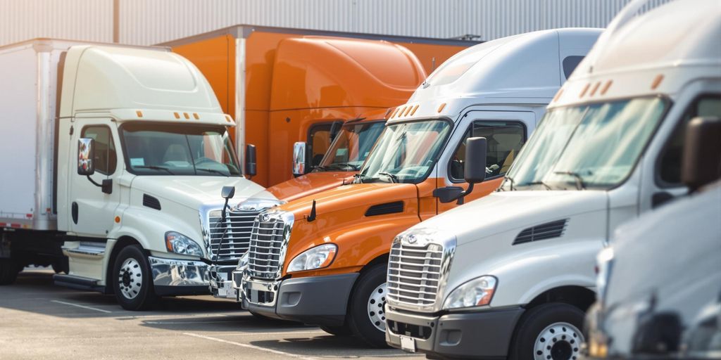 Diverse commercial vehicles in a business environment.
