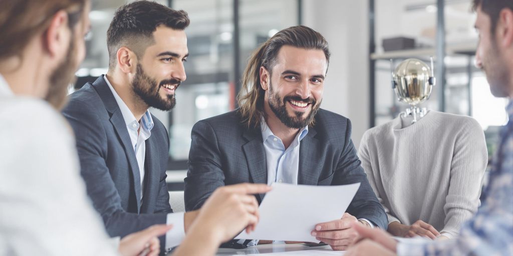 Business meeting discussing errors and omissions coverage.