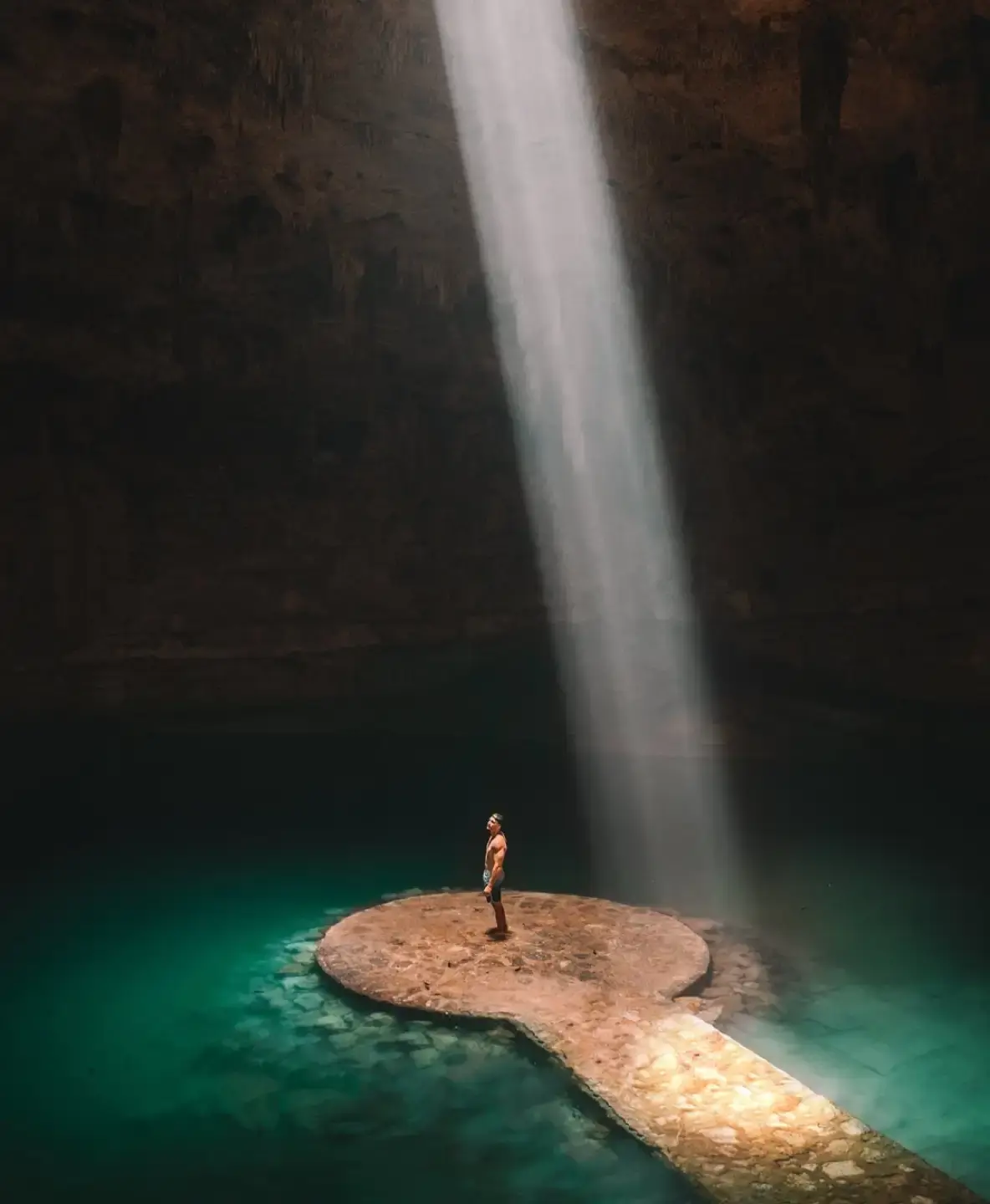 person-inside-cenote-in-tulum