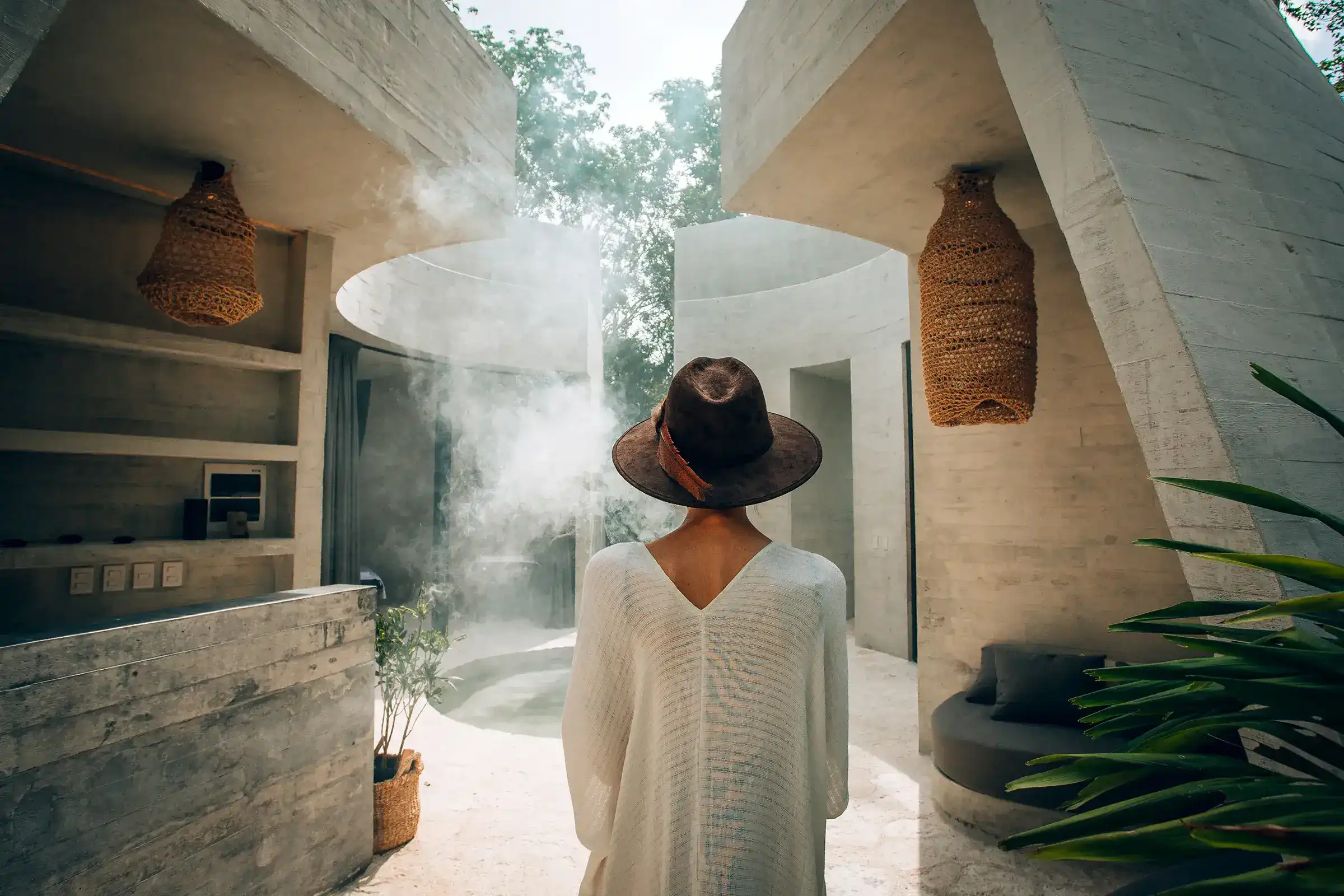 woman-with-hat-entering-spa-facilities