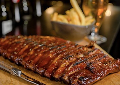 Rib meal plated dish at Flame Grill & Bar