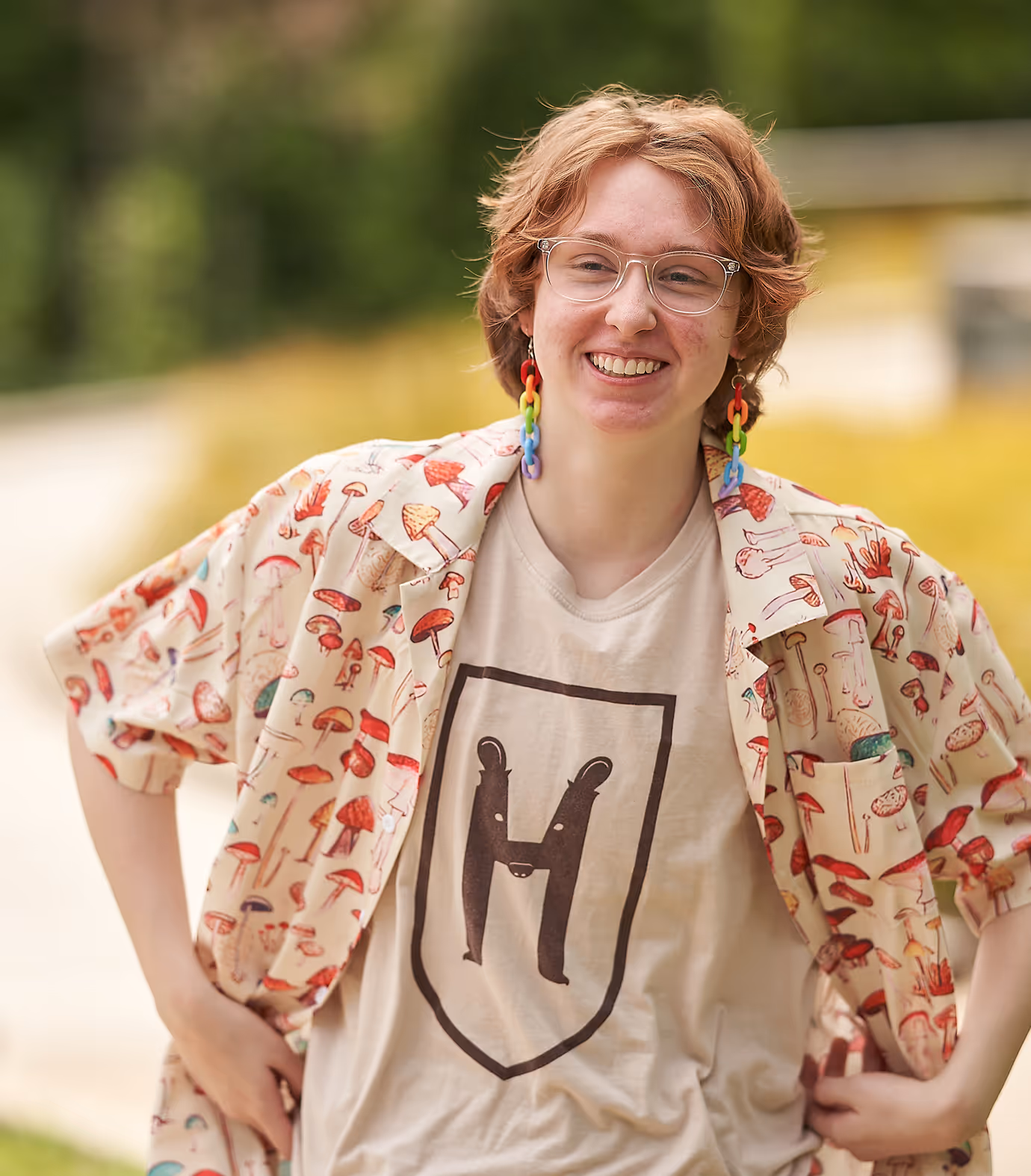 Young person standing outside smiling at camera