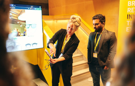 People viewing an app on a phone