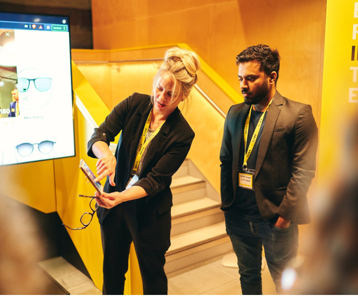 People viewing an app on a phone