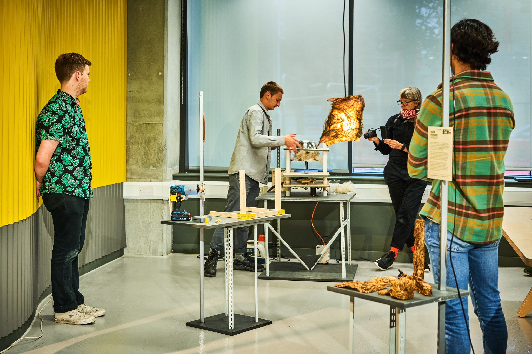 A group of people testing out a product in the Plus X Innovation workshop