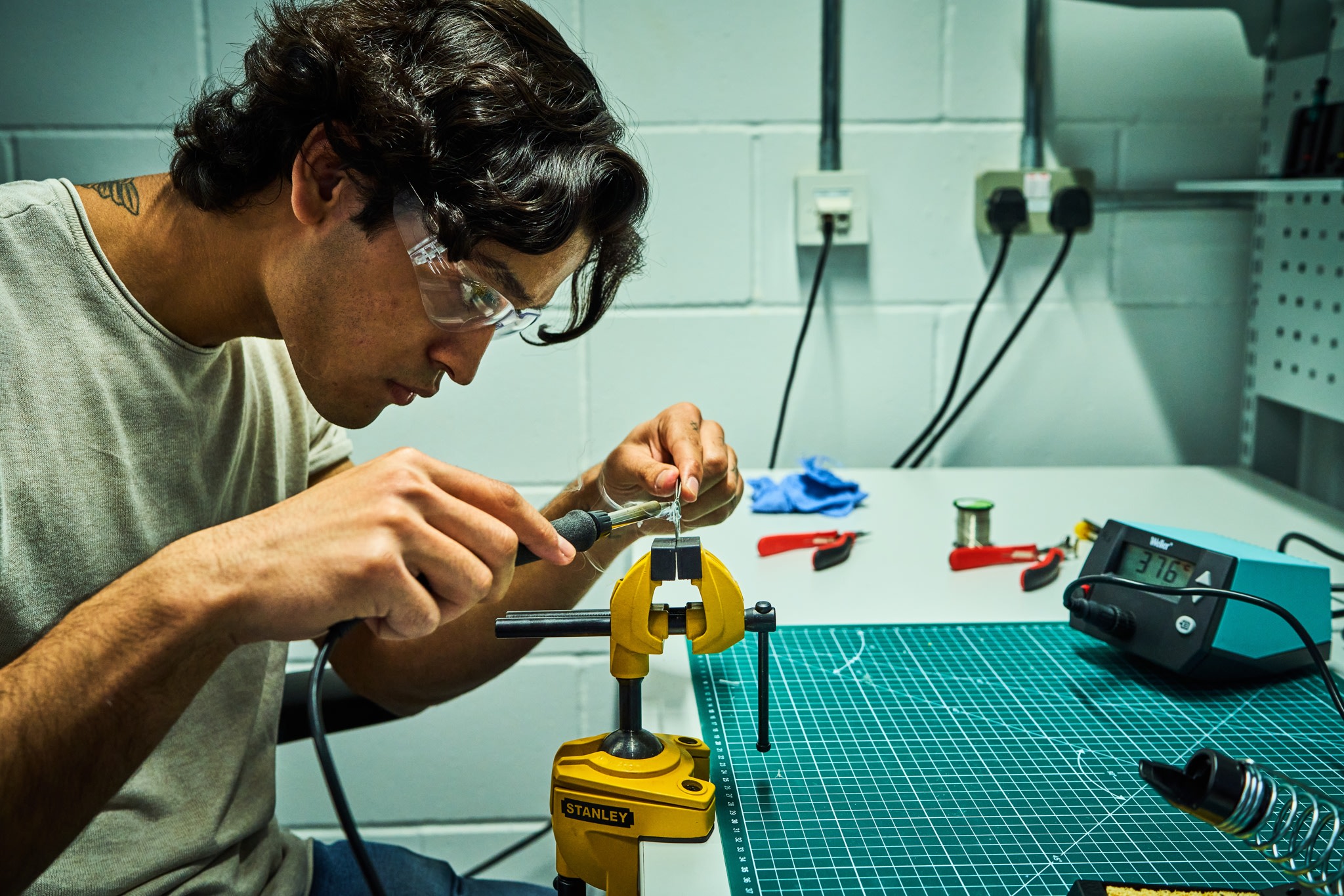 Man creating a prototype in the Plus X Innovation workshop