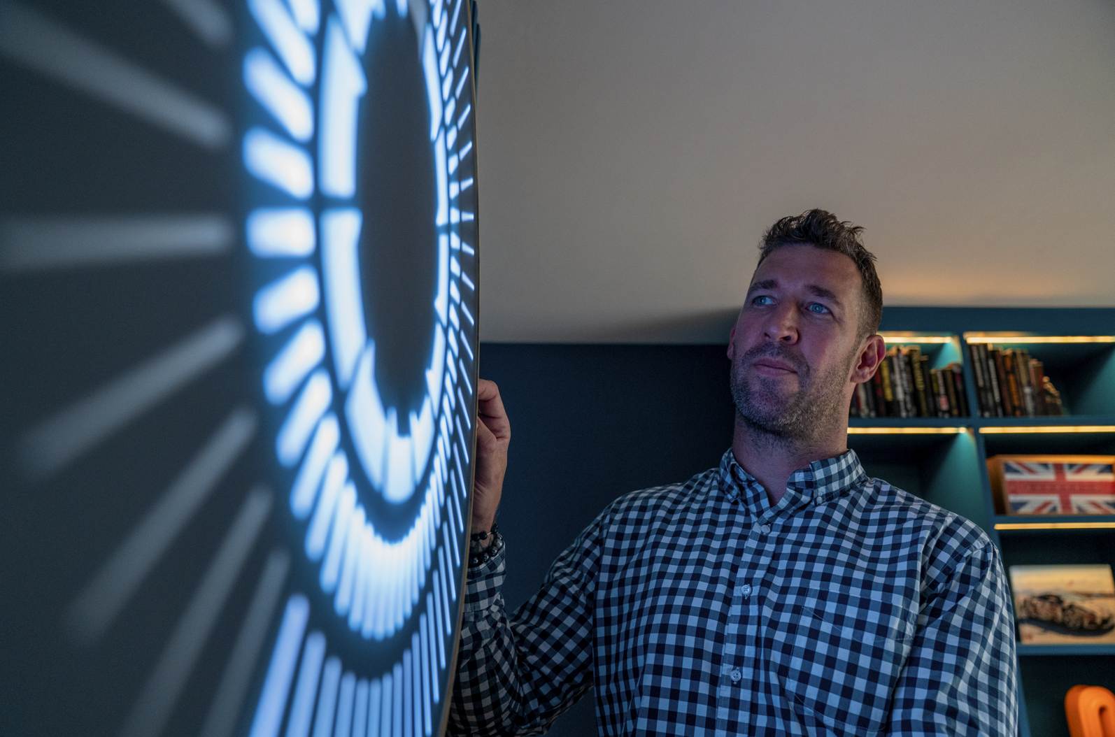 Ben Rousseau looking at his product